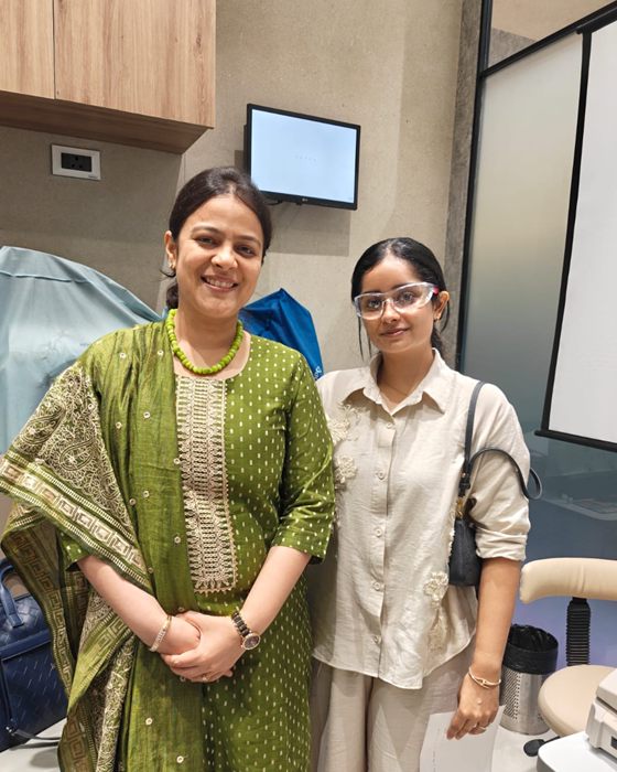 A patient with a member of the Clarity Eye Clinic team after her visit
