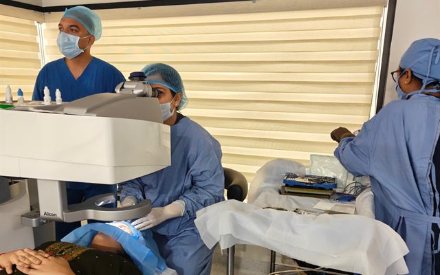 The surgical team at work in the eye theatre used by Clarity Eye Clinic