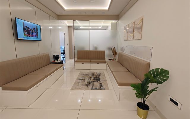 The waiting lounge at Clarity Eye Clinic with cushioned bench seating